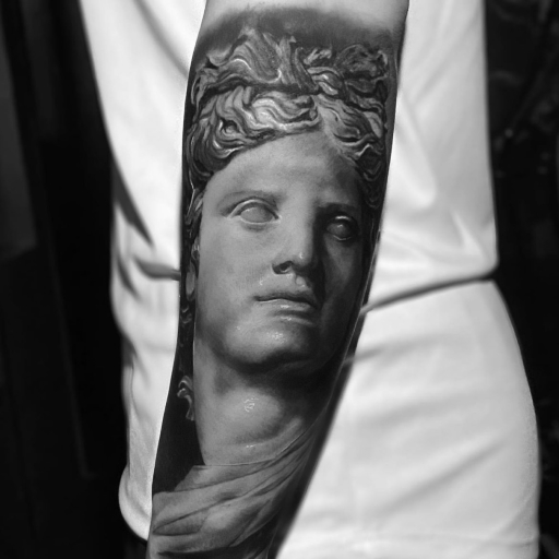 sleeve shot of a realism tattoo artist featuring a greek deity